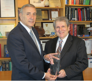 The Honorable Daniel A. Mica (l) presents Dr. Stephen I. Katz with the 2011 Paul G. Rogers Leadership Award.