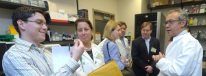 While touring NIAMS laboratories, congressional staffers heard from Dr. Vittorio Sartorelli (r) about how advanced technologies such as those that enable quick analysis of the human genome provide insight towards the understanding and treatment of disease.