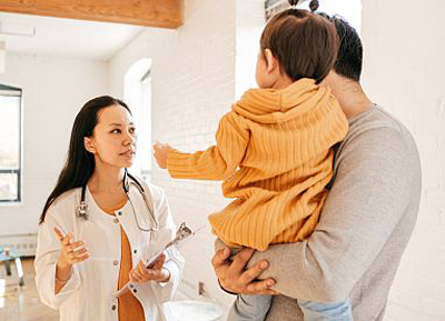 Doctor speaking with a parent and child